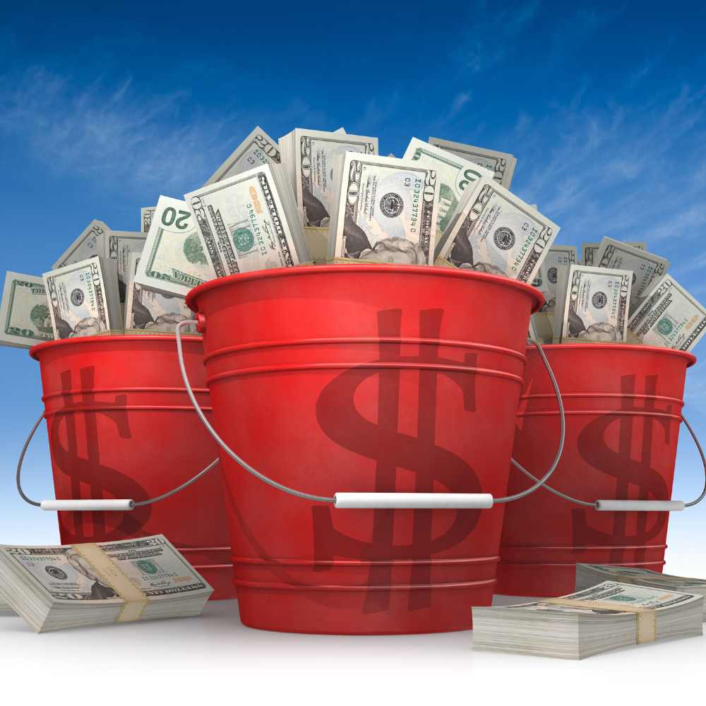 3 red buckets full of money